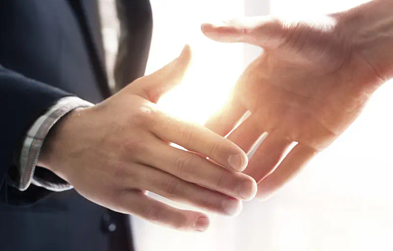 Negotiation Two business people shaking hands.